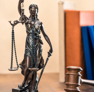 close-up-view-of-statue-of-lady-justice-and-mallet-2024-11-18-09-35-40-utc